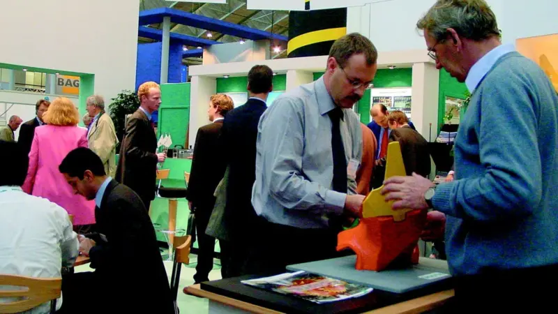 VOSTA LMGs Klass Wijma, who led the design team for the companys third generation cutterhead, shows cutterhead teeth at Europort 2003.
