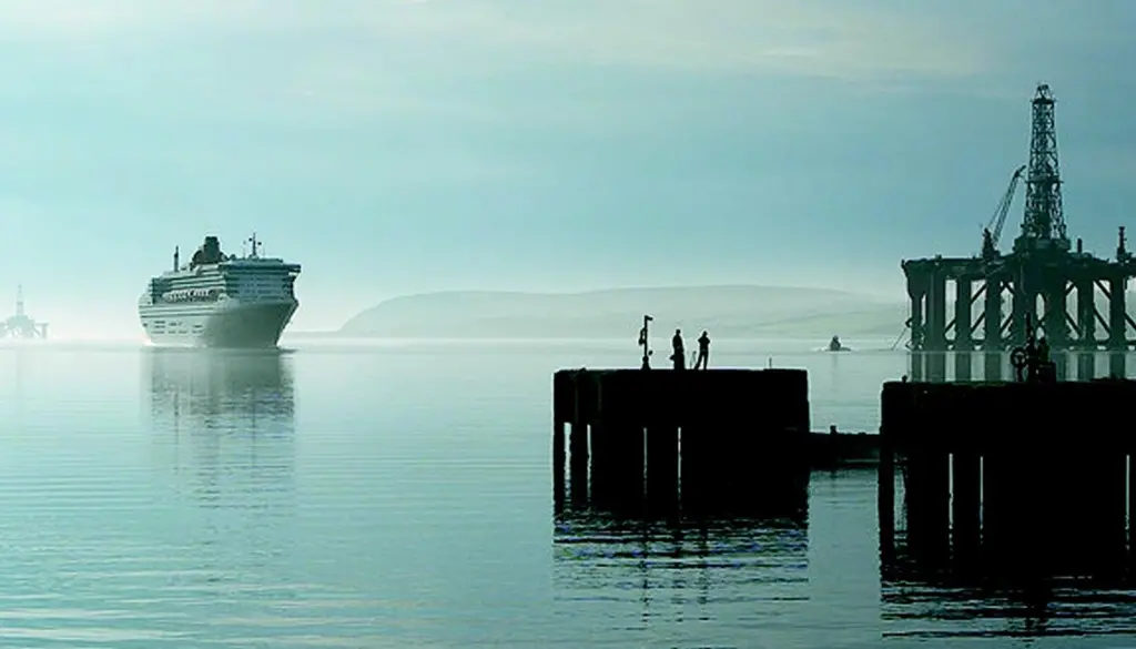 The Queen Mary 2 approaches moorings at Invergordons Admiralty Pier this summer.