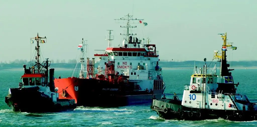 Multraship tugs pull the Philipp Essberger free in the River Scheldt. Photo by Lex de Meester.