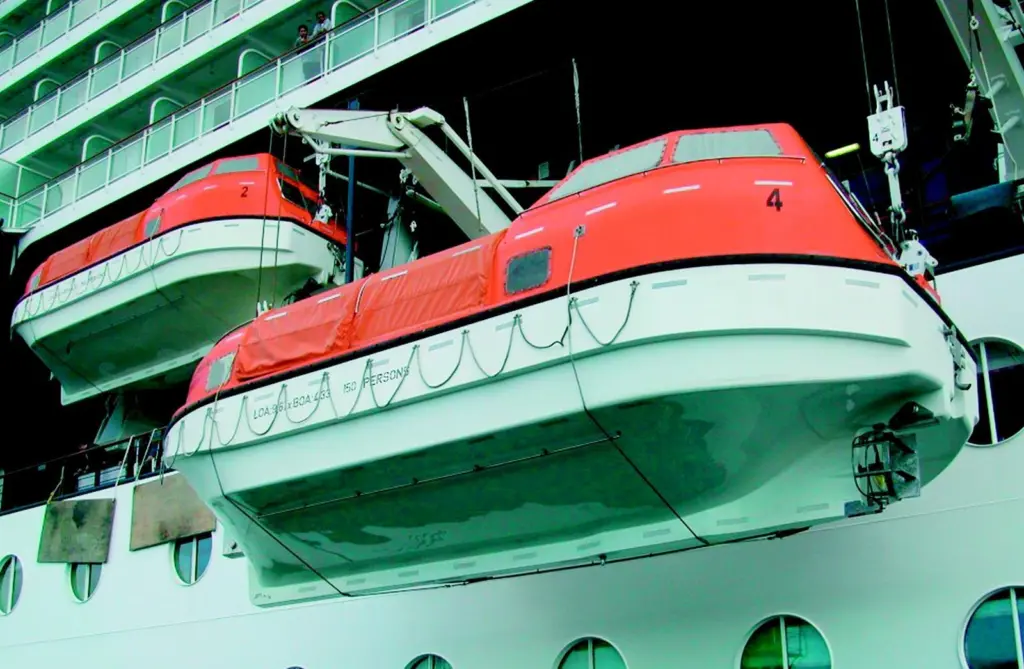 Two of the Millennium lifeboats are hoisted on their new hooks.