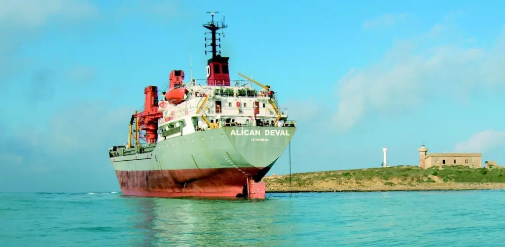 The Turkish vessel Alican Deval hard aground on a rocky ledge in Sicily.