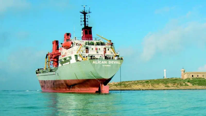 The Turkish vessel Alican Deval hard aground on a rocky ledge in Sicily.