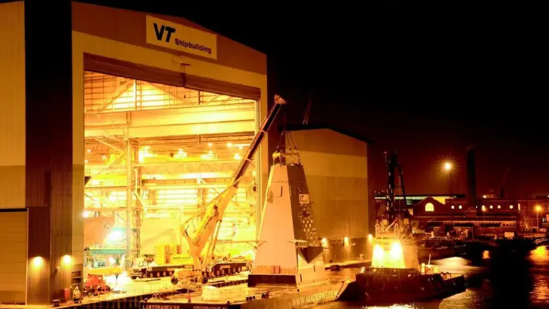The HMS Daring foremast is loaded onto a barge at VT Shipbuildings Portsmouth facility.