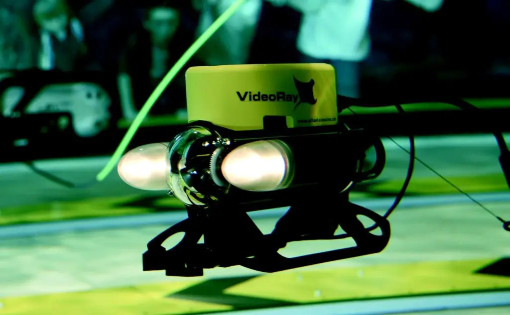 Visitors operate VideoRay Pro III ROVs in an interactive exhibition at ExplorOcean in Plymouth UK.