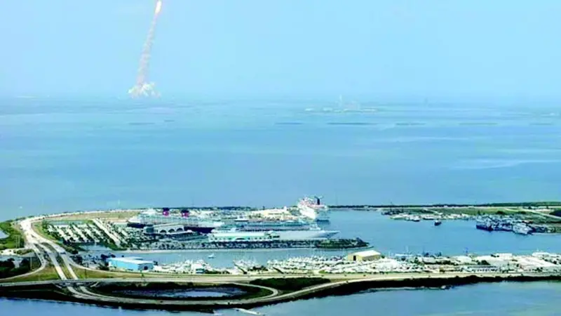 Cruise ships at Port Canaveral in Florida as a Space Shuttle takes off in the background. Photo courtesy of AAPA.