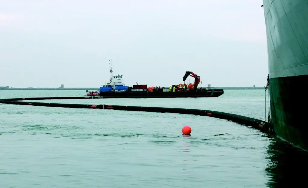 Special magnets designed and manufactured by Miko Marine attached an oil containment boom to a simulated casualty during Exercise Bluewater in March.