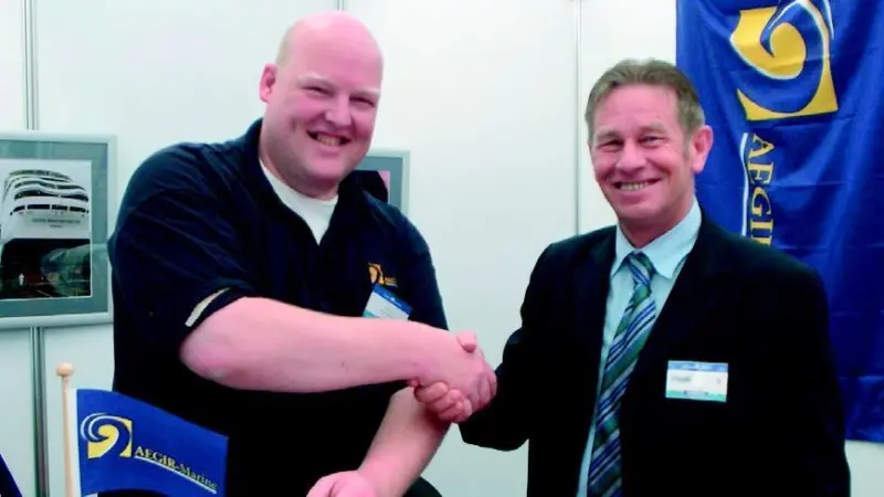 Rene Huybregts, ship repair manager for Hydrex, and Rudd Muis, director from AEGIR-Marine, conclude the new contract at Posidonia in Athens.