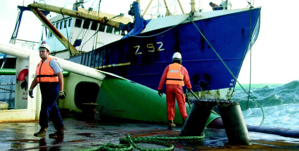 The crew of Anglian Earl get close up and uncomfortable to take the Yentl in tow.