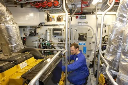 An engineer at work in the Tamar engine room.