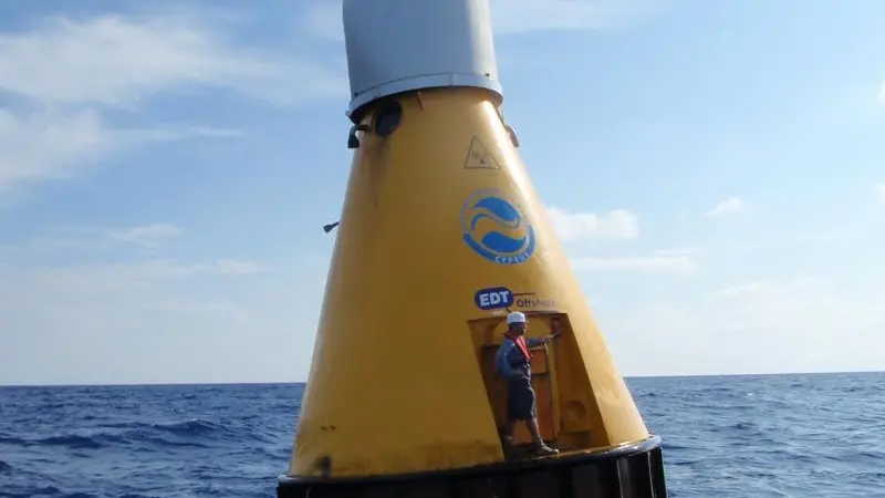 A technician prepares to conduct routine maintenance on the OceanNet buoy in the Mediterranean Sea.