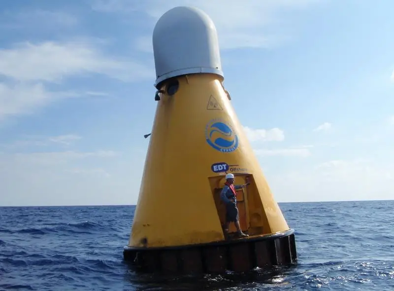 A technician prepares to conduct routine maintenance on the OceanNet buoy in the Mediterranean Sea.