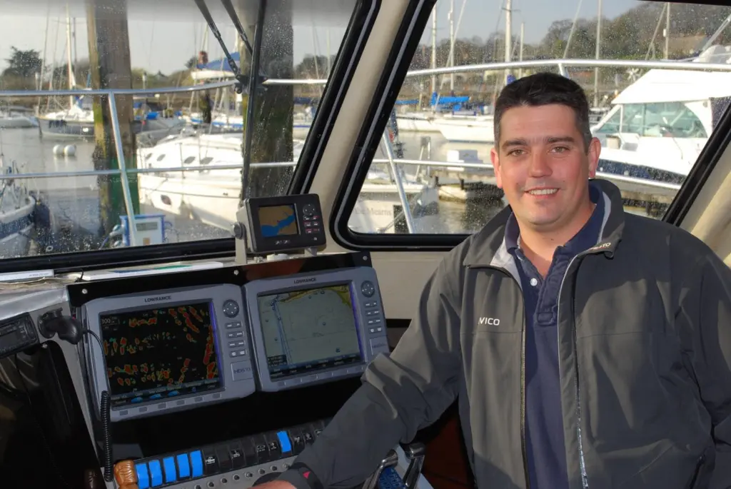 Owner/skipper Rob Thompson is seen with the Lowrance electronics in the wheelhouse.