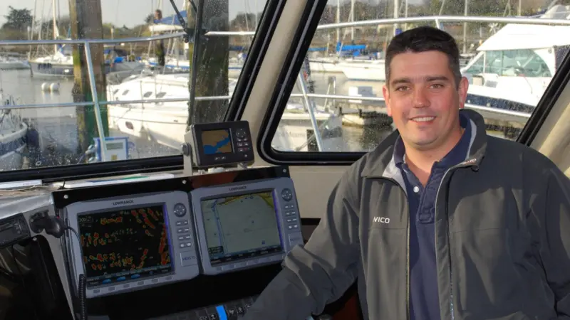Owner/skipper Rob Thompson is seen with the Lowrance electronics in the wheelhouse.