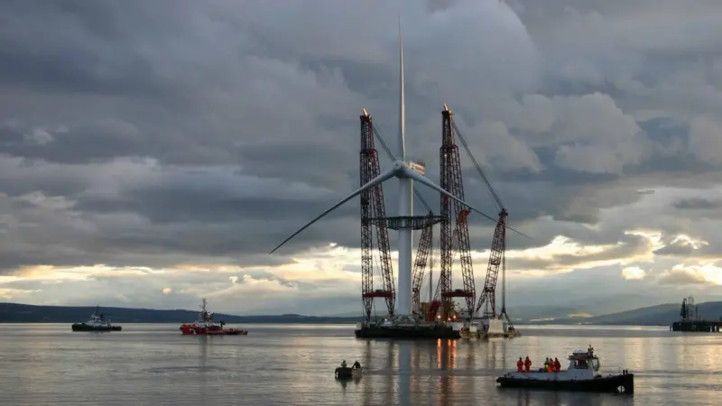 The floating sheerlegs Rambiz prepares to deliver a wind turbine for installation from Cromarty Firth.