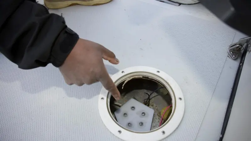 Stan Woodard points out his wireless fluid level measurement system, a spinoff technology originally developed to retrofit ageing aircraft with vehicle safety monitoring equipment.