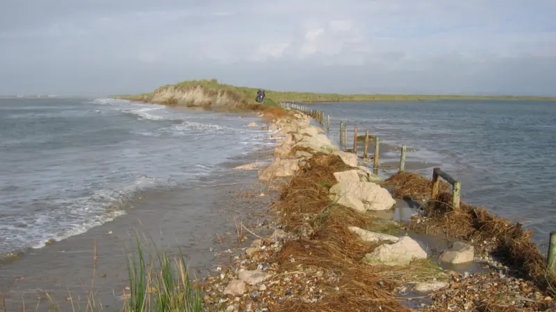 Beaches play an important role either as barriers to coastal flooding and erosion or as part of man-made defences.