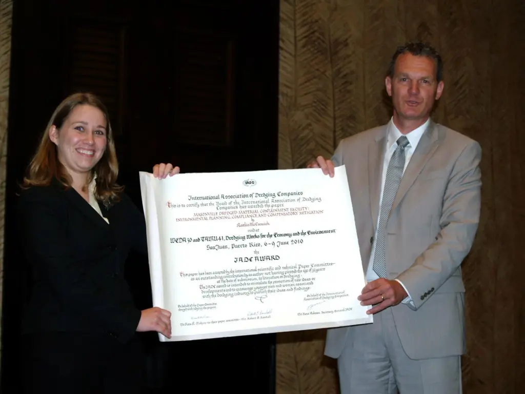A surprised and elated Kaitlin McCormick (left) receives the IADC Award for the Best Paper by a Young Author from IADC Secretary General Rene Kolman at the WEDA 30/TAMU 41 Conference held in Puerto Rico last month.