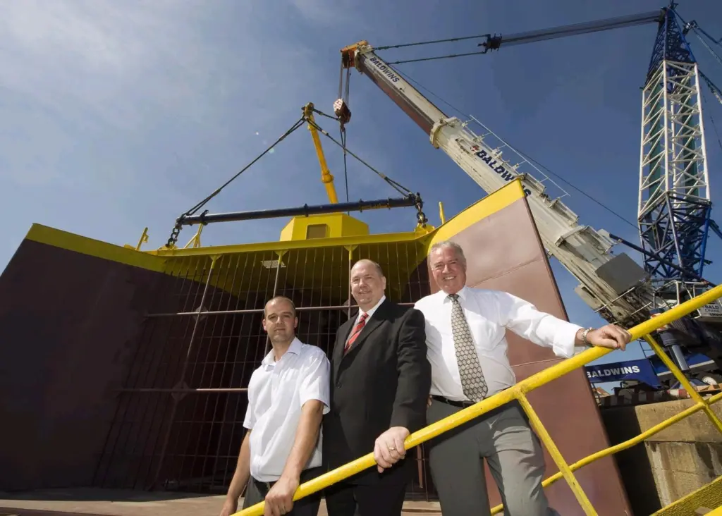 Cllr Paul Watson (centre) meets Jonathan (left) and Harry Wilson of Wear Dock and Engineering before the generator set sail.