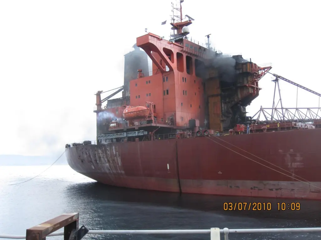 The fire spread to the accommodation block and the top of the engine room and an explosion resulted, caused by liquids detonating in the steering compartment.