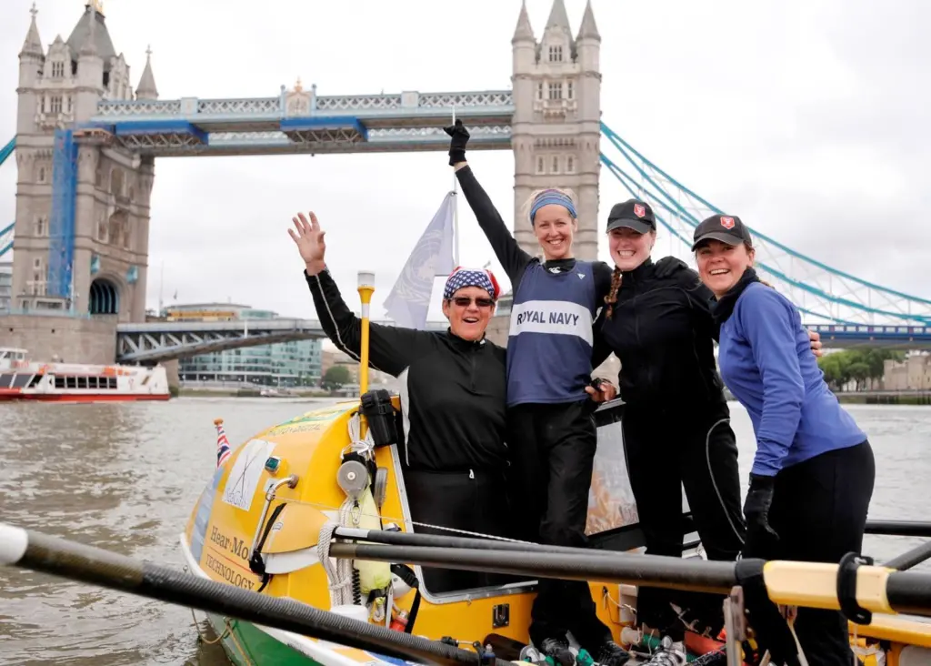 The successful team complete their row at London’s Tower Bridge on Sunday morning.