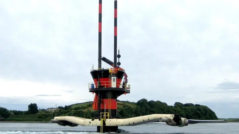 SeaGen is seen in Strangford Lough with its ‘underwater windmill’ rotors raised for maintenance. Note tidal flow past turbine tower. Photo courtesy of Marine Current Turbines.