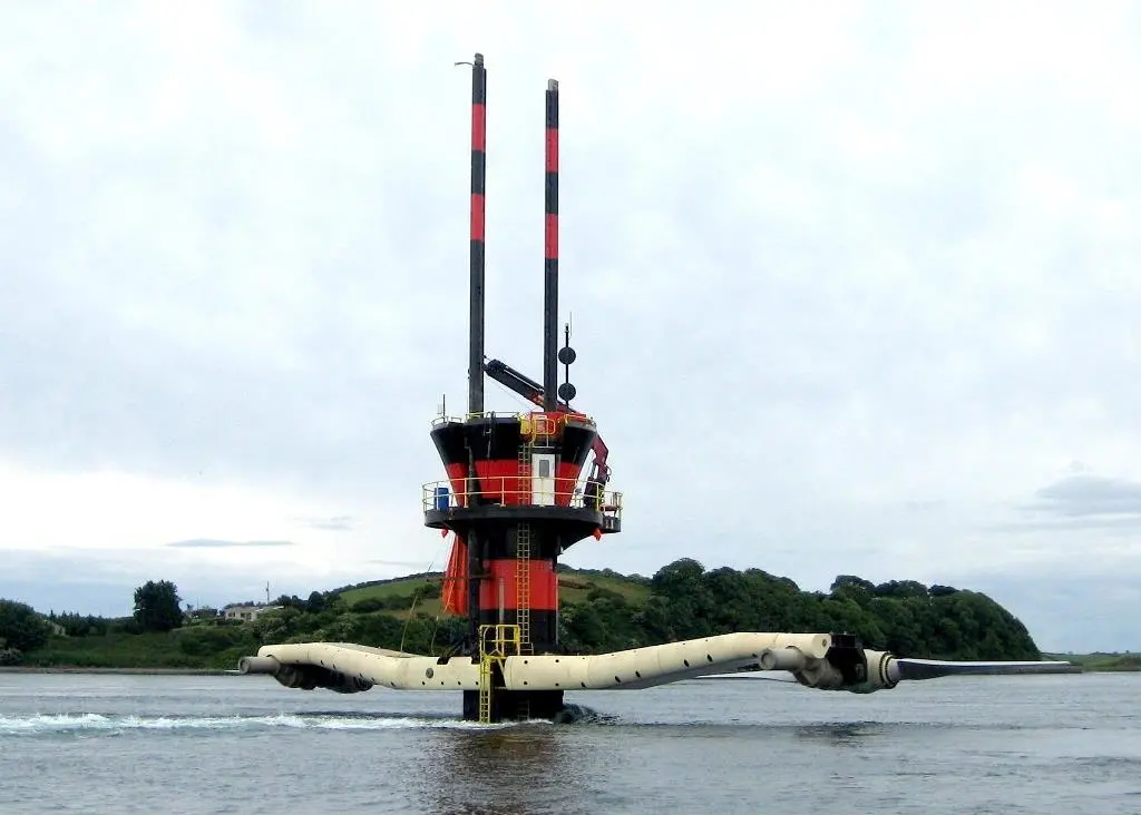 SeaGen is seen in Strangford Lough with its ‘underwater windmill’ rotors raised for maintenance. Note tidal flow past turbine tower. Photo courtesy of Marine Current Turbines.