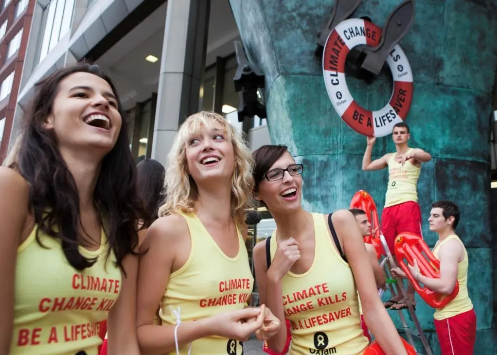 Oxfam activists deliver their message outside IMO headquarters on Monday.