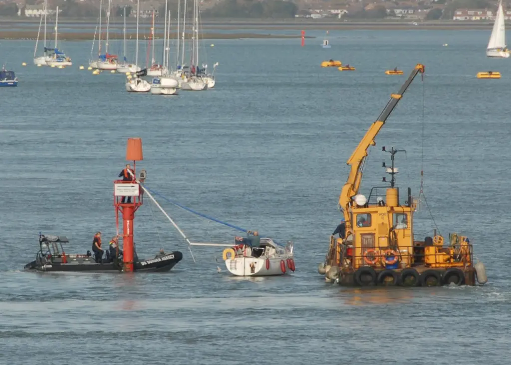 The yacht is rescued very quickly following its collision with the navigation mark. Photo by Graham Dubber