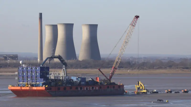 The barge UR101 is seen beached in Pegwell Bay earlier this year while carrying out the shore landing of the export cable for the Thanet Offshore Wind Farm. Photo by Peter Barker