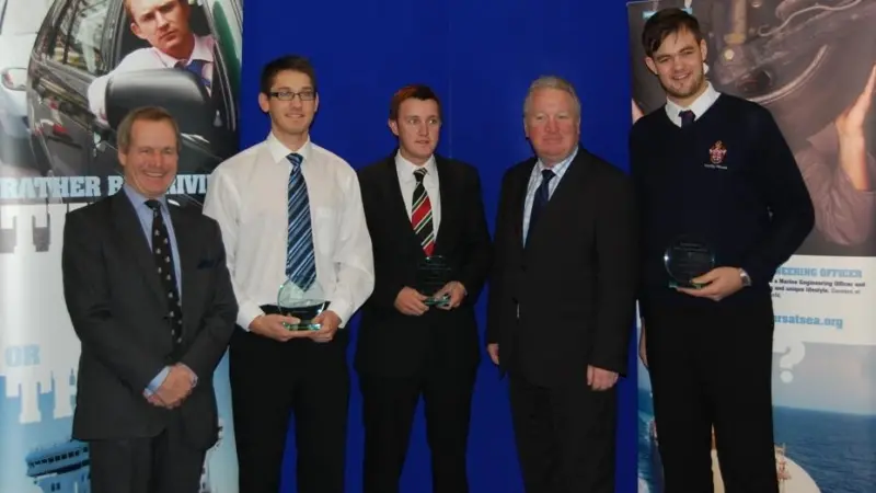 Rear Admiral Sir Jeremy de Halpert KCVO, CB, Deputy Master of Trinity House (left) is seen with winners Steven Walker and Adam Creber, UK shipping minister Mike Penning MP, and winner Simon Curtis.