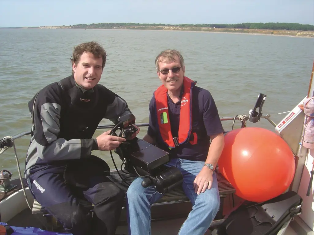 Television presenter and historian, Dan Snow, (left) and Mike Sawkins from MacArtney with the diver held DIDSON system.