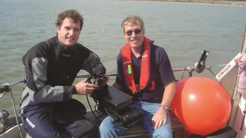 Television presenter and historian, Dan Snow, (left) and Mike Sawkins from MacArtney with the diver held DIDSON system.