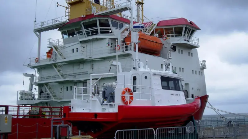 Dec 11: SMB ‘James Caird IV’ is seen on the quay with mothership ‘HMS Protector’ alongside