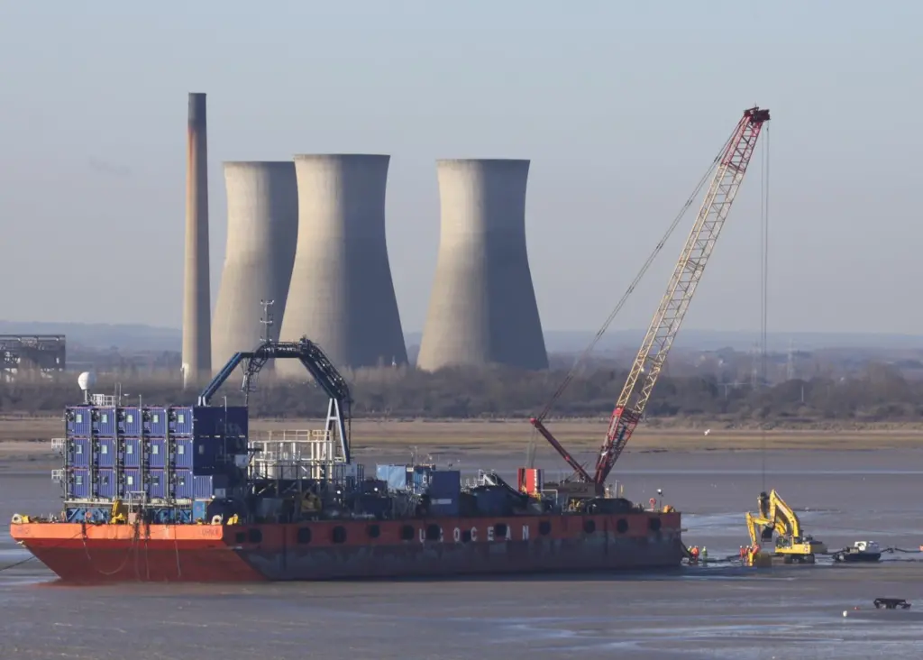 A single EU electricity market will require considerable marine works, such as this shore landing of a cable. Photo by Peter Barker.