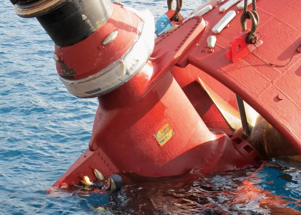 A Hydrex diver accompanies a thruster removed from an offshore crane barge off the coast of Gabon.