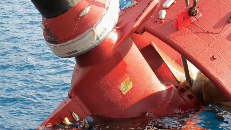 A Hydrex diver accompanies a thruster removed from an offshore crane barge off the coast of Gabon.