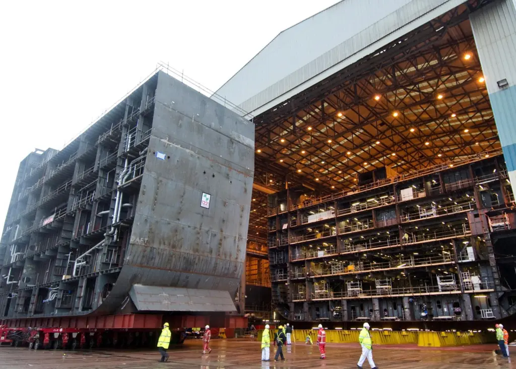 A 1,221 ton hull section is moved 100m across the Govan shipyard to join a second section.