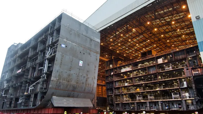 A 1,221 ton hull section is moved 100m across the Govan shipyard to join a second section.