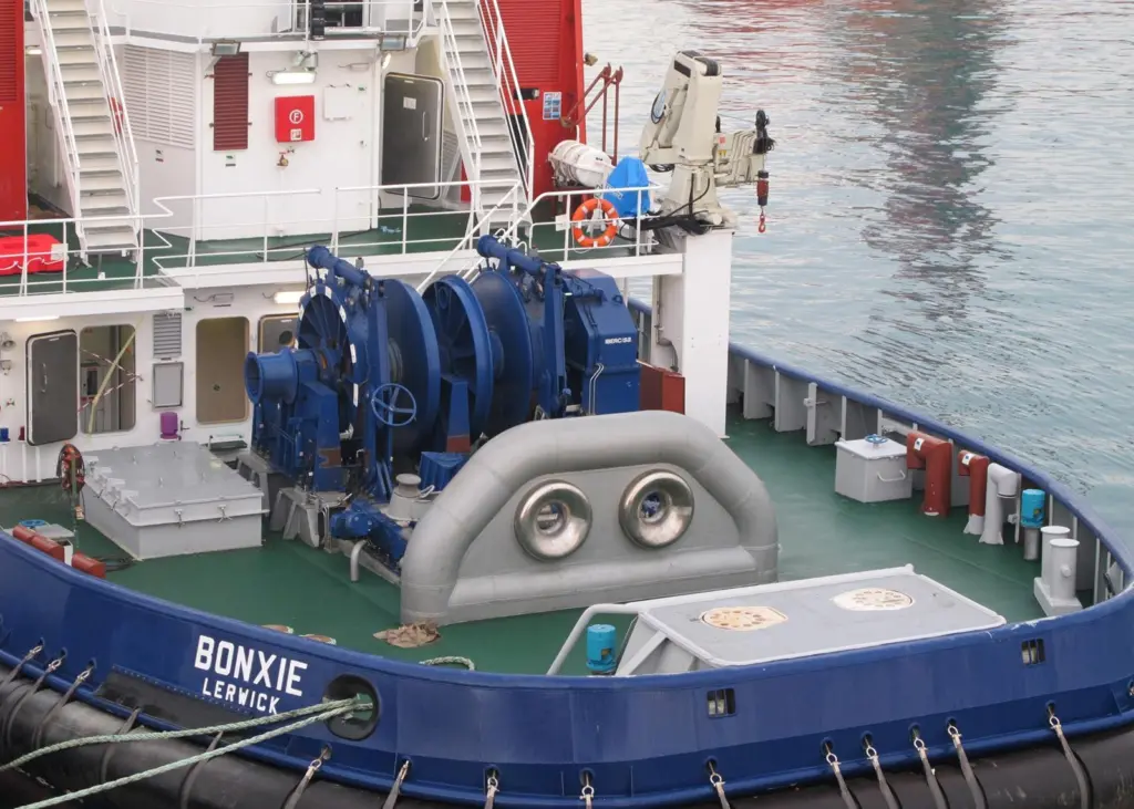 The after deck is dominated by the electrically powered towing winch and massive towing staple with its stainless steel inserts. (Photo courtesy of Ole Dahl)