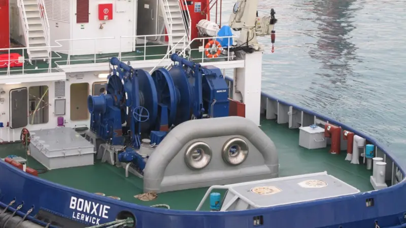 The after deck is dominated by the electrically powered towing winch and massive towing staple with its stainless steel inserts. (Photo courtesy of Ole Dahl)