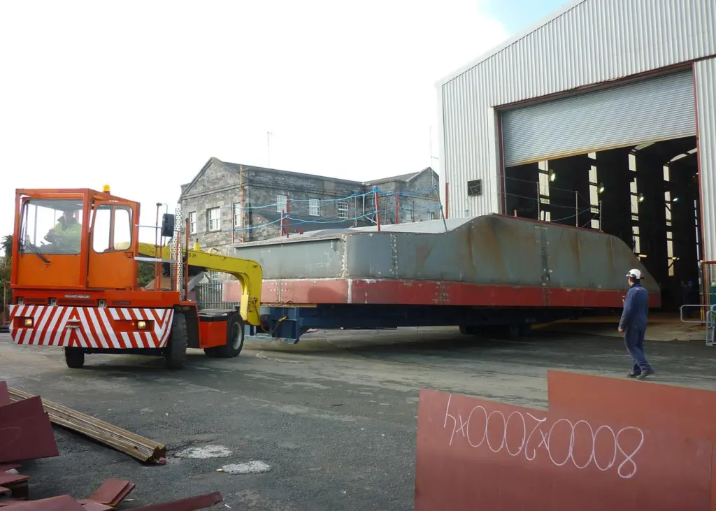 The hull of the first Mustang built Damen Multicat is manoeuvred at the Pembroke Dock shipyard.