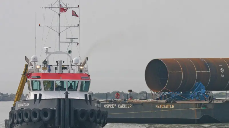 A barge carrying monopile foundations arrives at Ramsgate for the Thanet Offshore Windfarm.