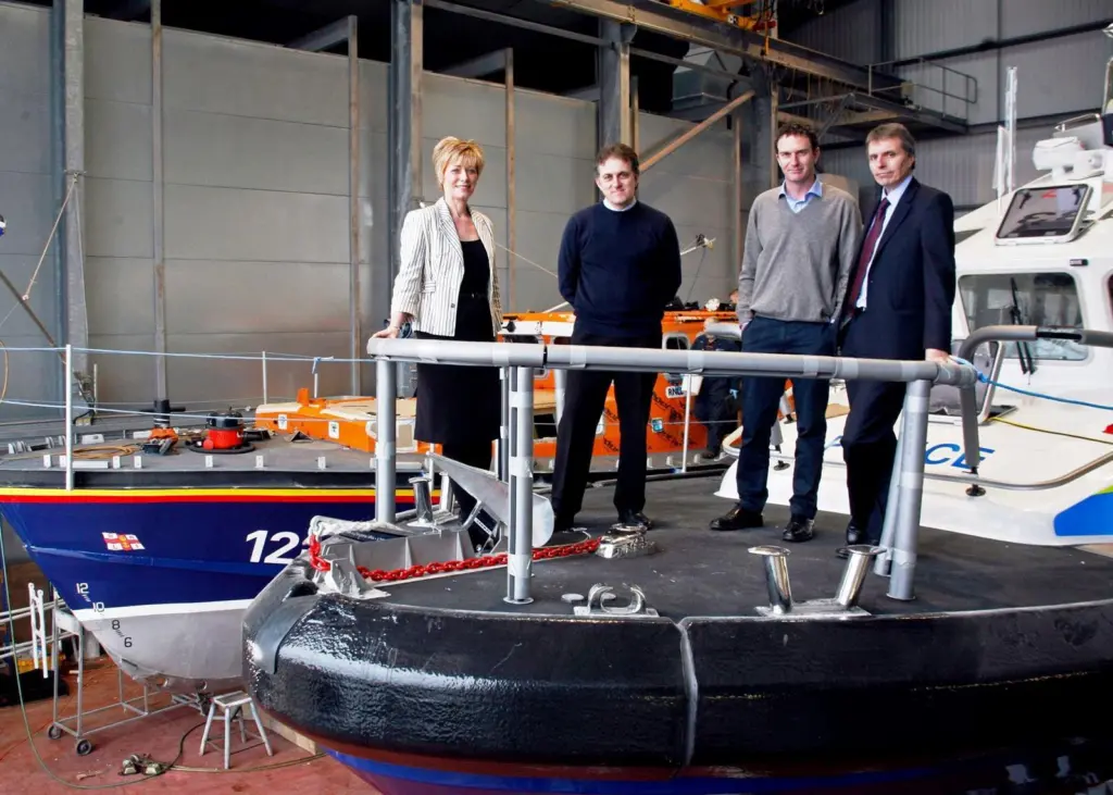 Heather Abrahams, Finance Wales; Nick Colin York, MD Holyhead Marine Services; James Burns, operations director Holyhead Towing Company and Alan Darrock, financial director, in the Holyhead Marine Services shed.