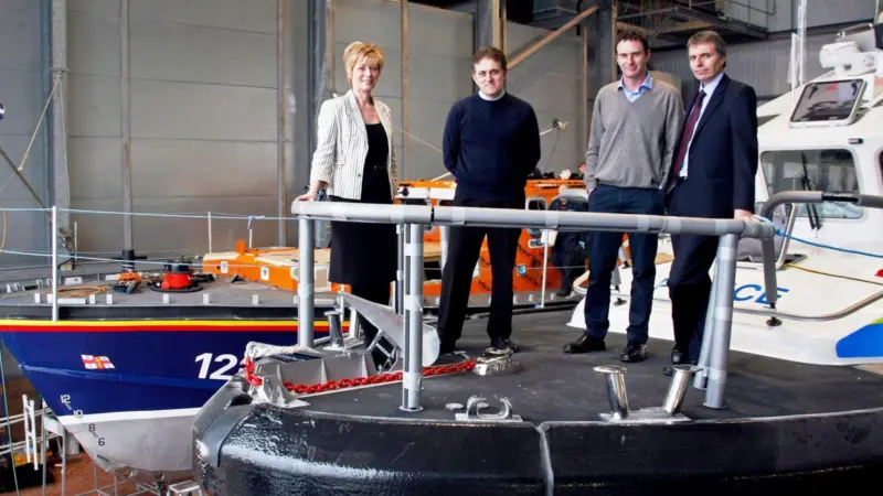 Heather Abrahams, Finance Wales; Nick Colin York, MD Holyhead Marine Services; James Burns, operations director Holyhead Towing Company and Alan Darrock, financial director, in the Holyhead Marine Services shed.