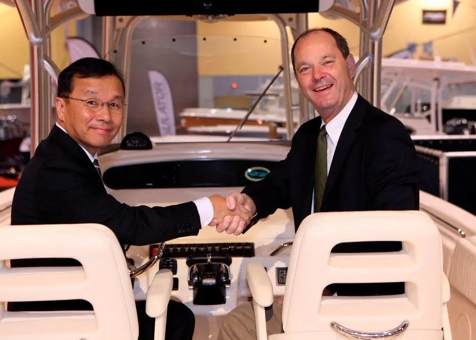 Takaaki Kimura, senior managing executive officer of Yamaha Motor and Volvo Penta CEO Göran Gummeson shake hands at the Miami Boat Show 2011.