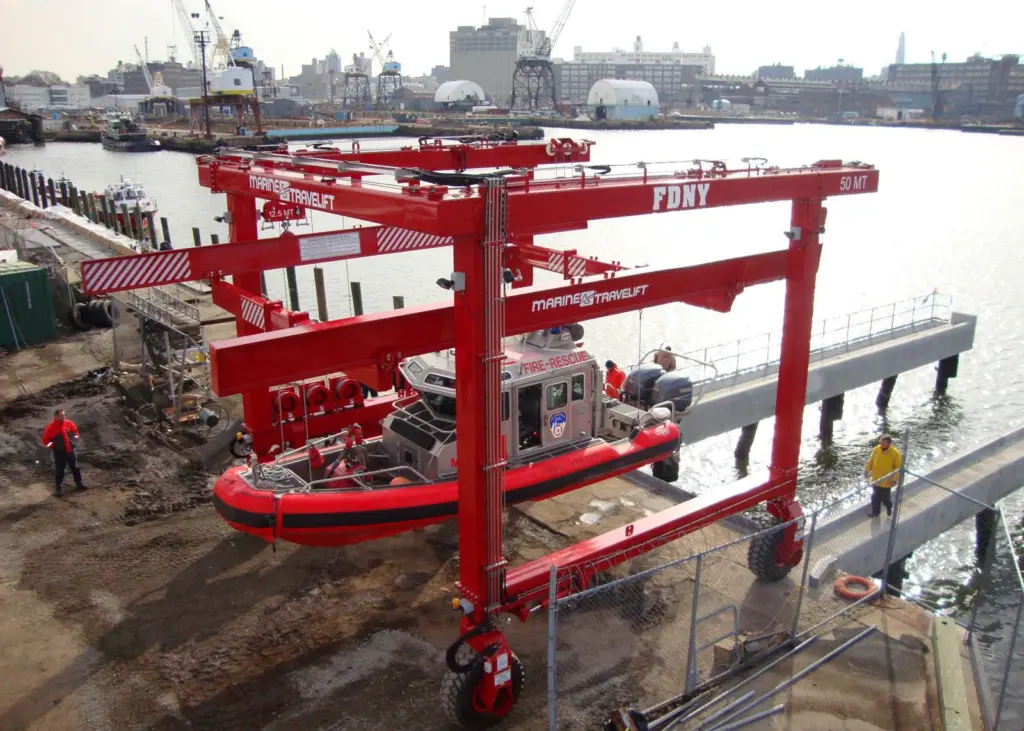 The 50 BFMII mobile boat hoist has custom built spreaders to allow foam collared vessels to be lifted by a single pick point.