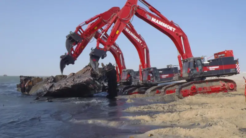 The excavators, seen working from shore, will primarily be deployed from a pontoon during the Mauretania project.