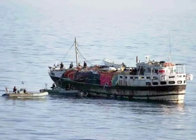 A suspected pirate mother ship is searched by a US Navy patrol.