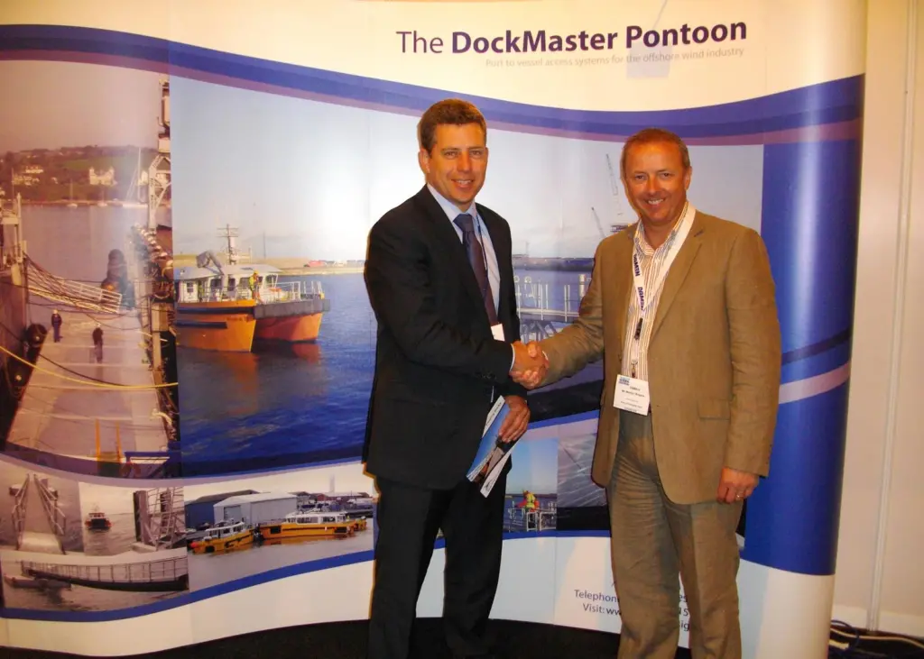 Marine Design Ltd MD Drystan Jones and Martyn Boyers celebrate another pontoon order at Seawork 2011.