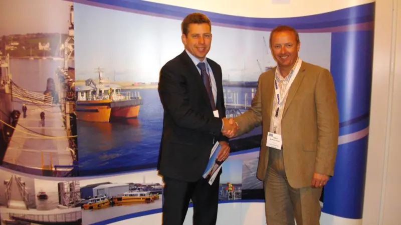 Marine Design Ltd MD Drystan Jones and Martyn Boyers celebrate another pontoon order at Seawork 2011.